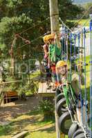 Climbing visitors in adventure park