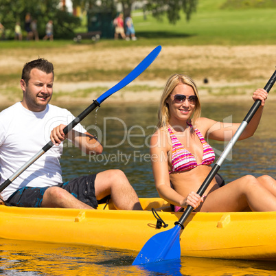 Couple sitting in kayak on a sunny day