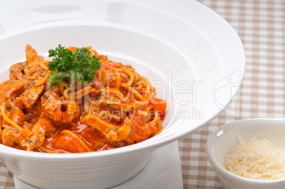 Italian spaghetti pasta with tomato and chicken