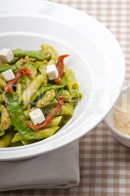 Italian penne pasta with sundried tomato and basil