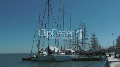 Tall ships sailboats race in harbor