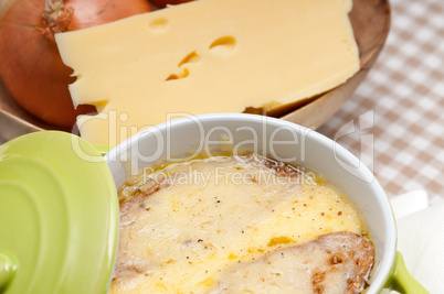 oinion soup with melted cheese and bread on top