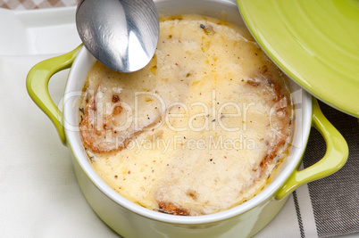 oinion soup with melted cheese and bread on top