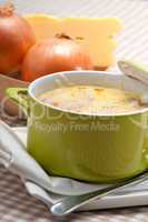 oinion soup with melted cheese and bread on top