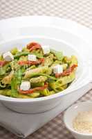 Italian penne pasta with sundried tomato and basil