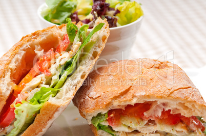 ciabatta panini sandwich with chicken and tomato