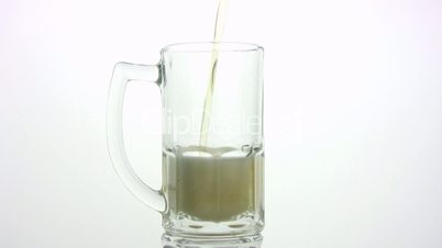 The beer is poured in a mug. White background
