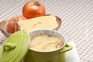 oinion soup with melted cheese and bread on top