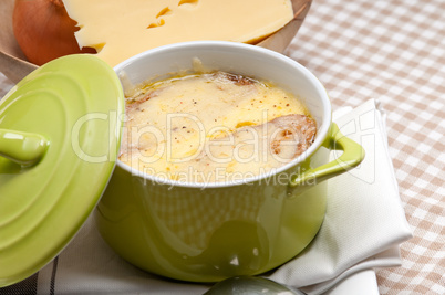 oinion soup with melted cheese and bread on top