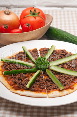 Turkish beef pizza with cucumber on top