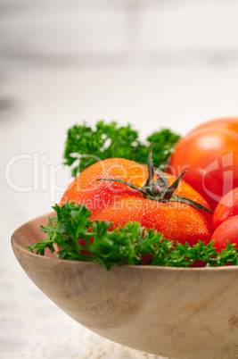 tomatoes on a wood bowl