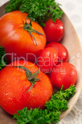 tomatoes on a wood bowl