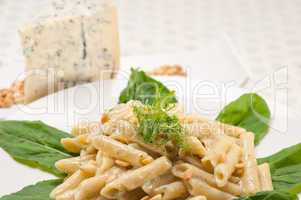 Italian pasta penne gorgonzola and pine nuts