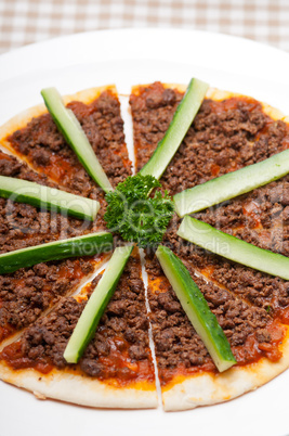 Turkish beef pizza with cucumber on top