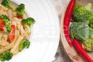 Italian penne pasta with broccoli and chili pepper