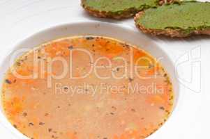 Italian minestrone soup with pesto crostini on side