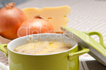 onion soup with melted cheese and bread on top