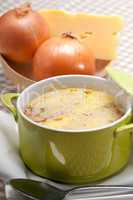 onion soup with melted cheese and bread on top