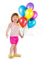 Little girl smiling with balloons.