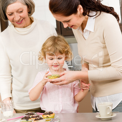 Women generations around cupcake cookies