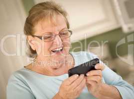 Senior Adult Woman Texting on Smart Cell Phone