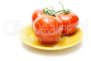 red tomatoes on plate