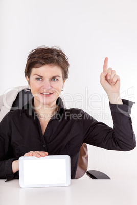 Woman holding tablet and raises a finger