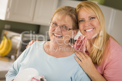 Senior Adult Woman and Young Daughter Portrait in Kitchen