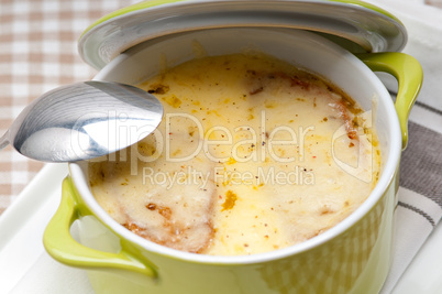 onion soup with melted cheese and bread on top