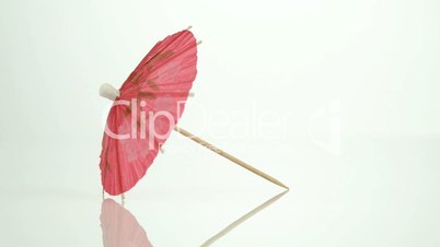 Pink paper cocktail umbrella