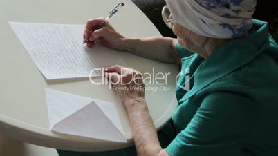 old woman writing letter