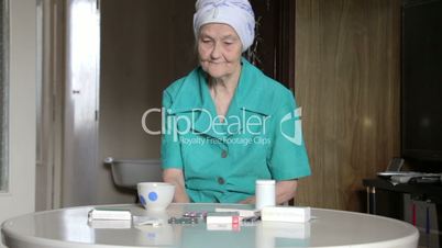old woman taking pill