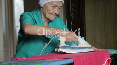old woman ironing