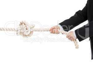 business man hand holding or pulling rope with tied knot