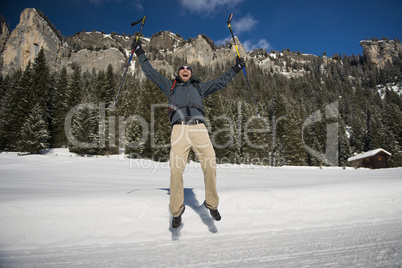 Hiker Jumping on a snowy Trail