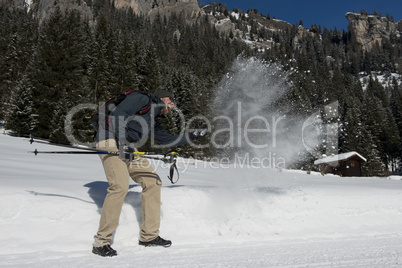 Hiker playing with the Snow