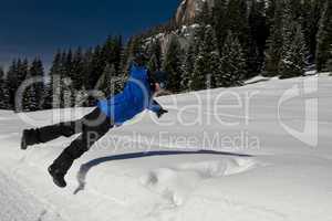 Teenager Jumping into the Snow