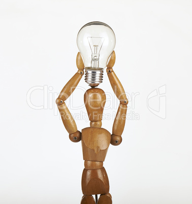 wooden dummy thinking with idea bulb above his head over white b