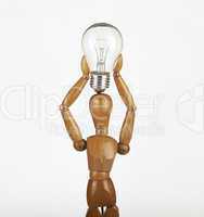 wooden dummy thinking with idea bulb above his head over white b