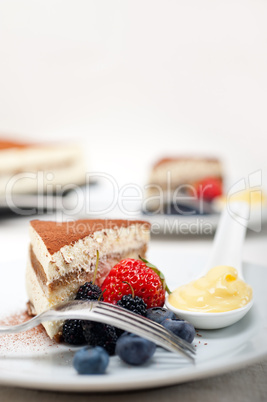 tiramisu dessert with berries and cream