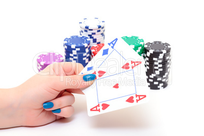 Hand with two Aces and Stacks Poker Chips