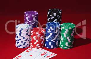 Stacks of Poker Chips with Playing Cards