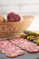 cold cut platter with pita bread and pickles