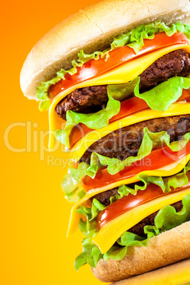 Tasty and appetizing hamburger on a yellow