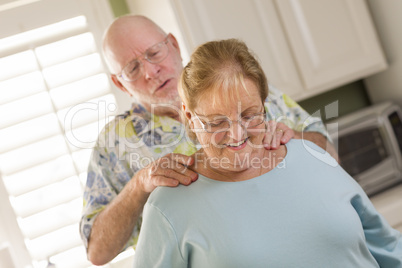 Senior Adult Husband Giving Wife a Shoulder Rub
