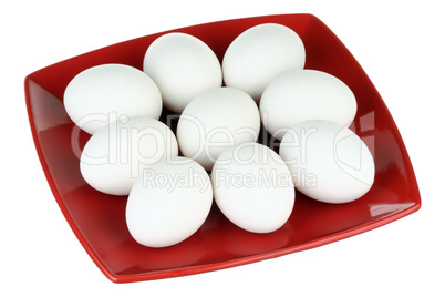 White eggs and red plate