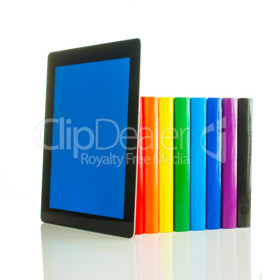 Row of colorful books and tablet PC