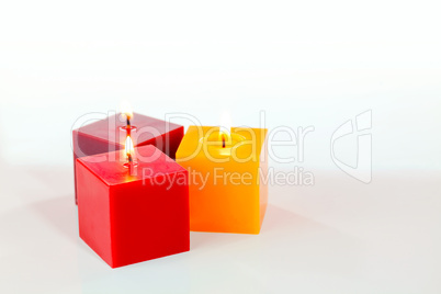 Three burning candles