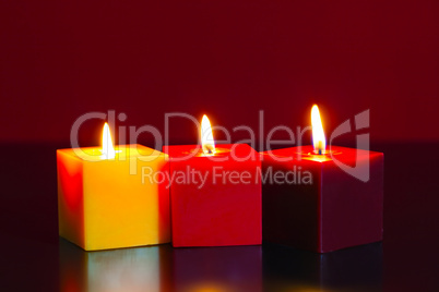 Three burning candles