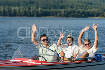 Cheerful young guys partying in speed boat